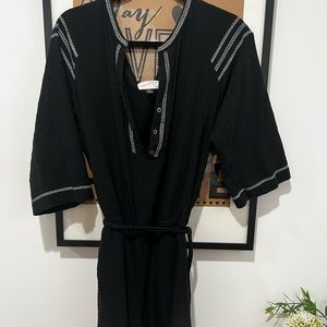 Black target romper. Comes with a belt. Could be styled with heels or flats.